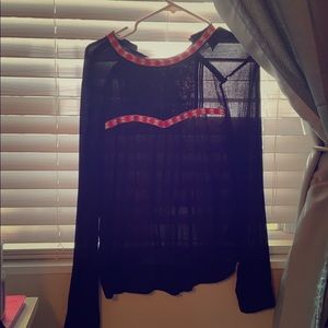 Black bouse. Lace and red detail.